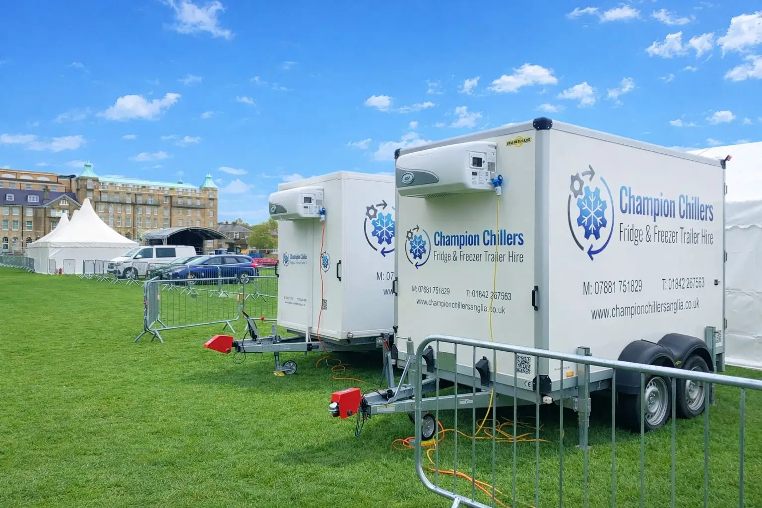 Two Champion Chillers fridge and freezer trailer hire units set up side by side at an outdoor event.